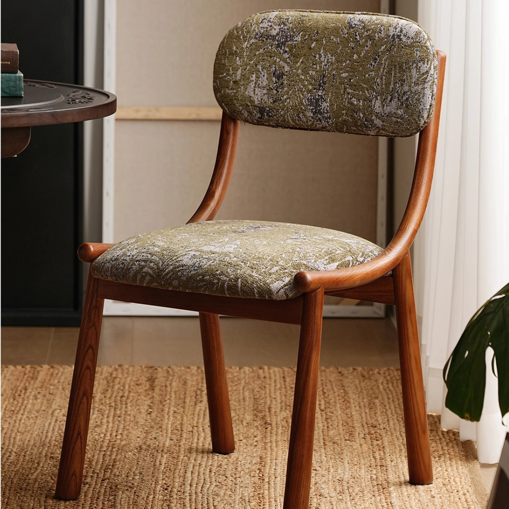  Green Fabric Dining Chair With Wooden Legs in a mid century dining room close up