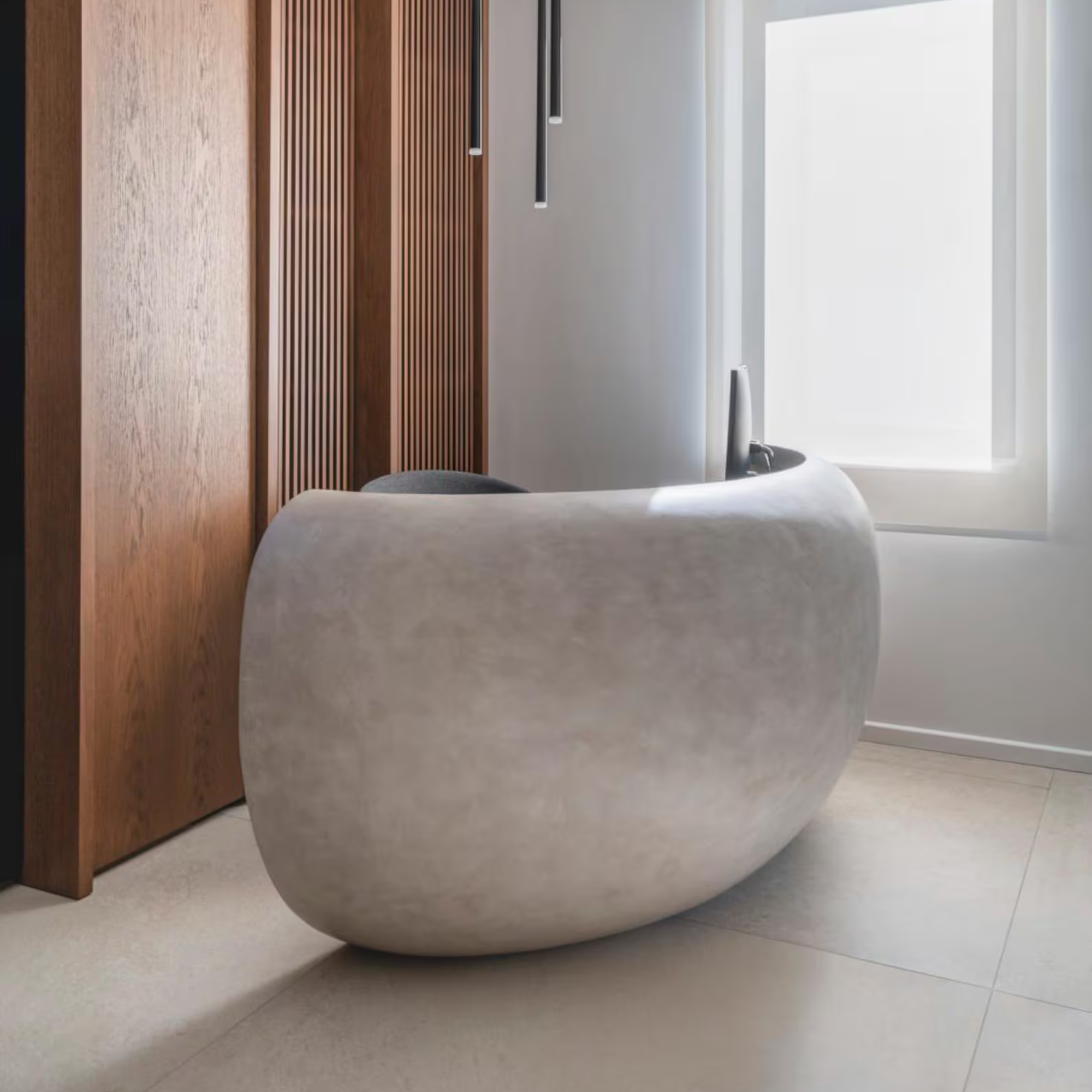 Modern Concrete Curved Reception Desk with wooden paneling and a window.