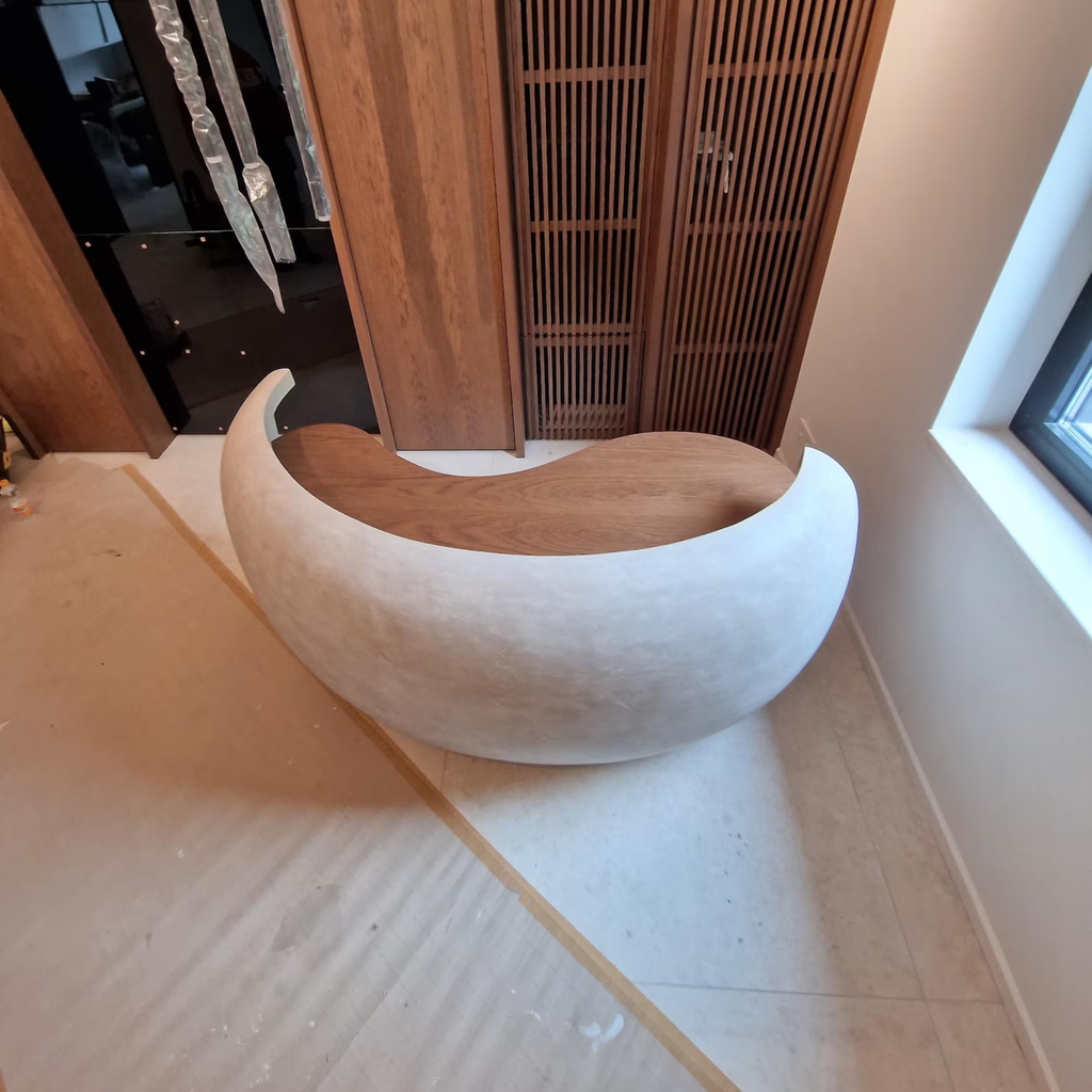 Concrete Curved Reception Desk on a light-colored floor
