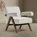  Boucle Fabric Statement Chair with wooden legs in a minimalistic setting