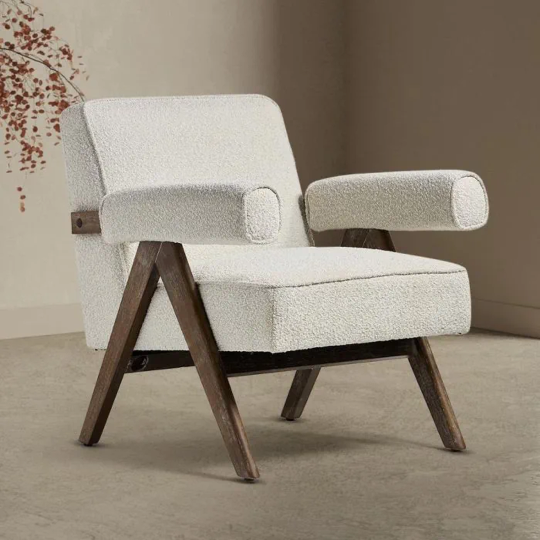  Boucle Fabric Statement Chair with wooden legs in a minimalistic setting