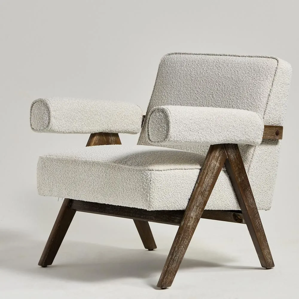  Boucle Fabric Statement Chair with textured beige cushion and wooden legs on a light gray background