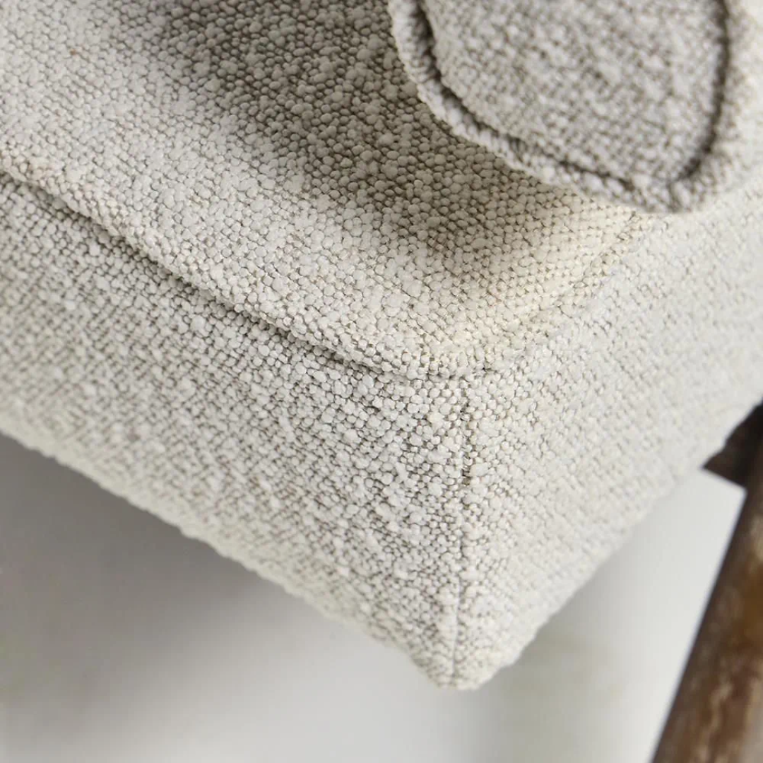Close-up of a textured beige fabric surface