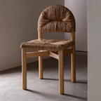 Woven chair with wooden frame on a neutral background