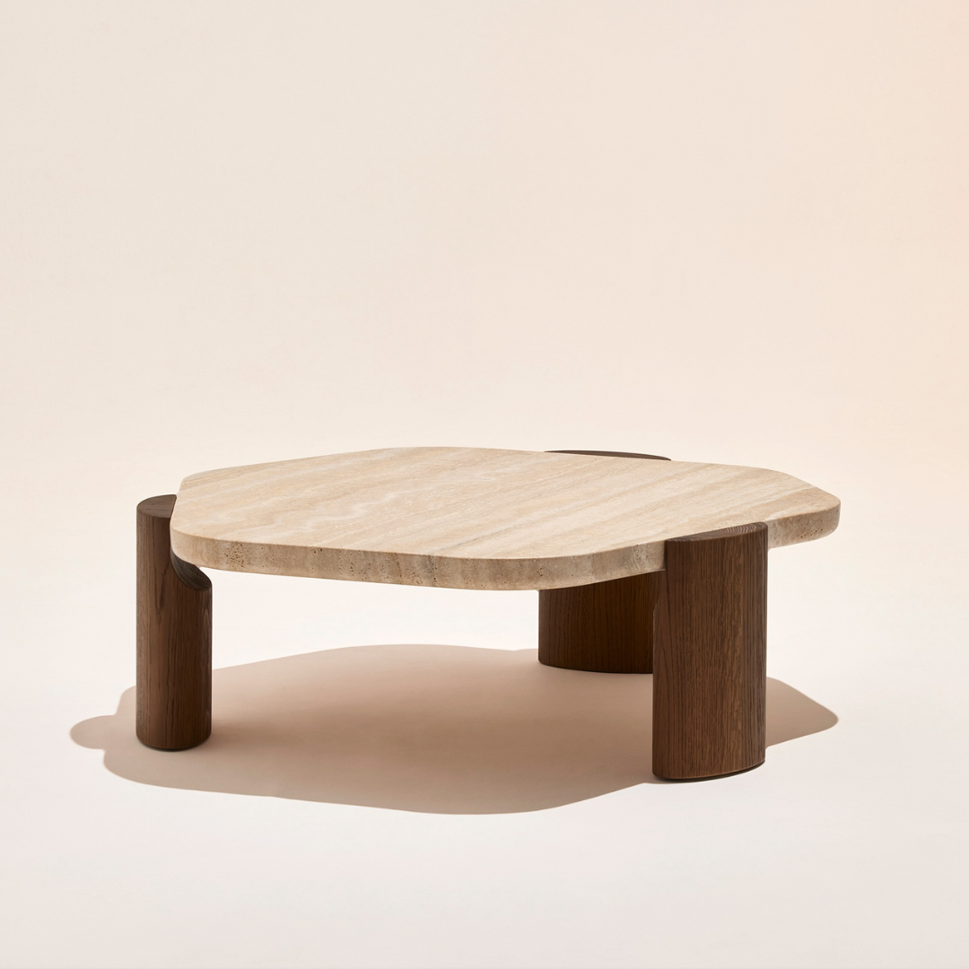 Curved Concrete Effect Coffee Table and dark wooden legs on a beige background