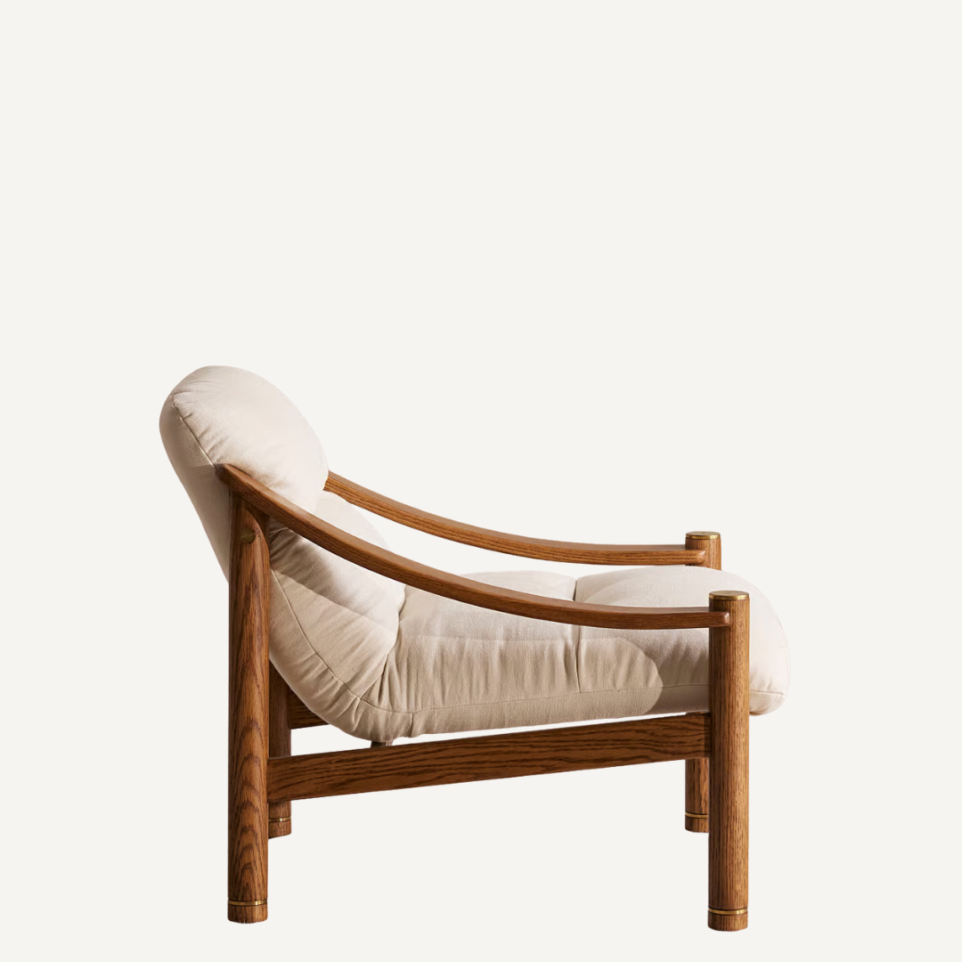 Wooden armchair with beige cushion on a white background