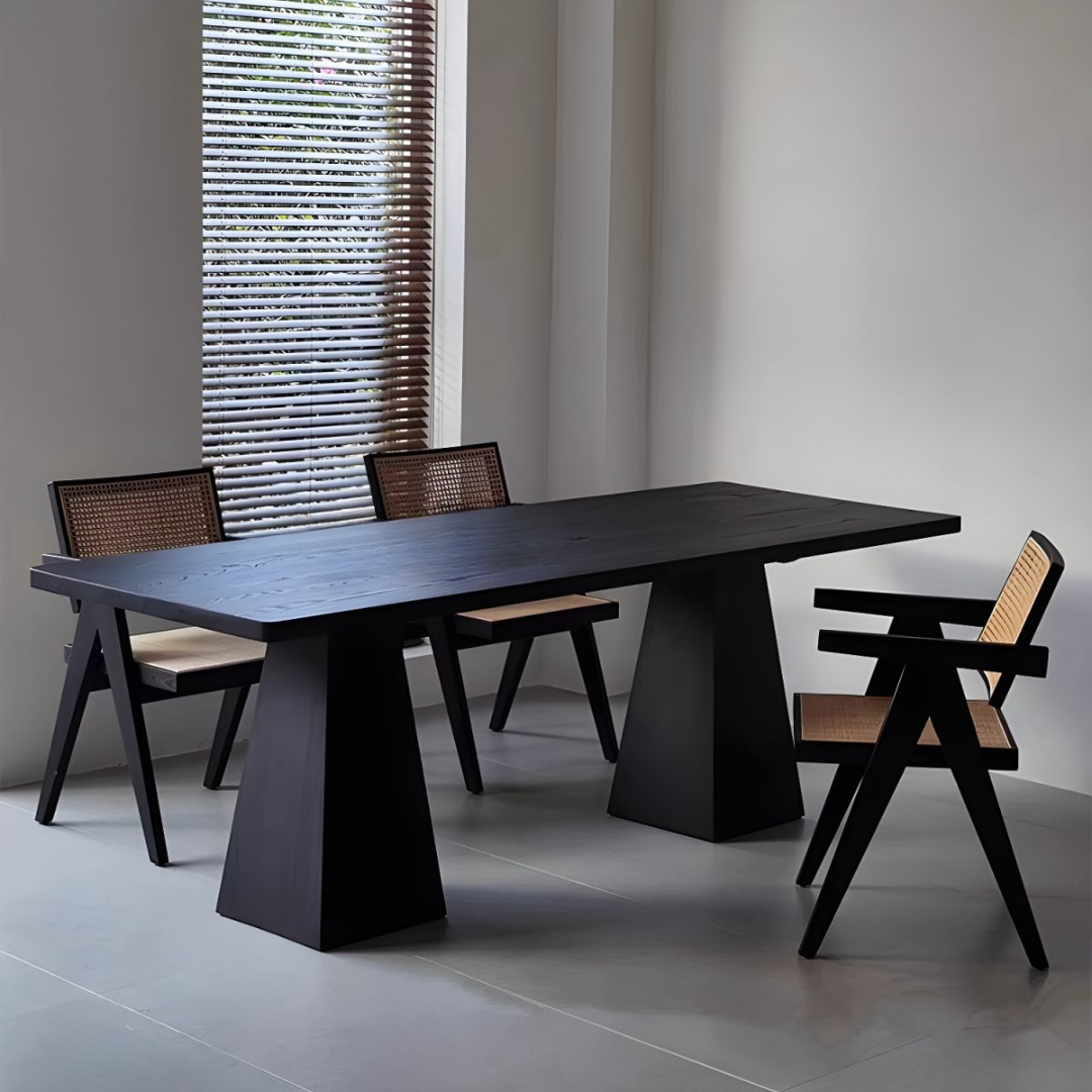  Black Rectangular Dining Table with four chairs in a minimalistic room.