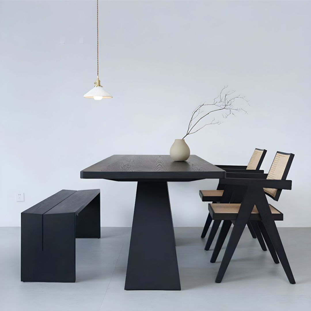 Modern  Black Rectangular Dining Table with chairs and a bench in a minimalistic setting.