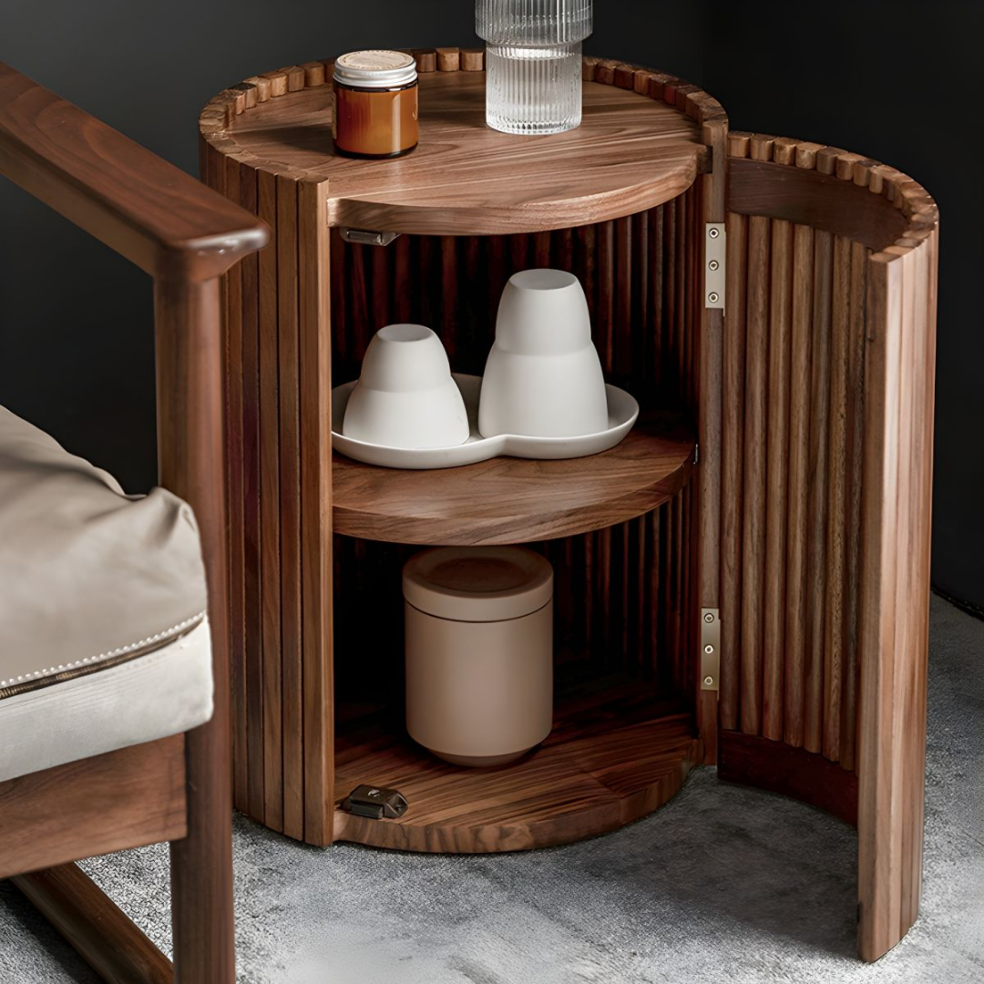 Wooden side table with storage compartments and decorative items on a dark background