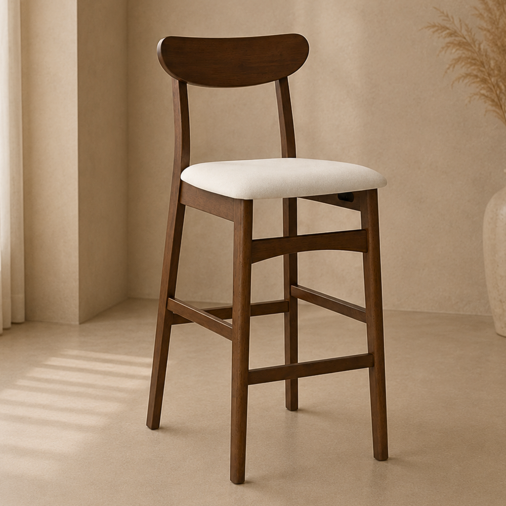 A wooden bar stool with a curved backrest and a cream-colored upholstered seat, set in a warm, minimalist interior with beige walls and floor.