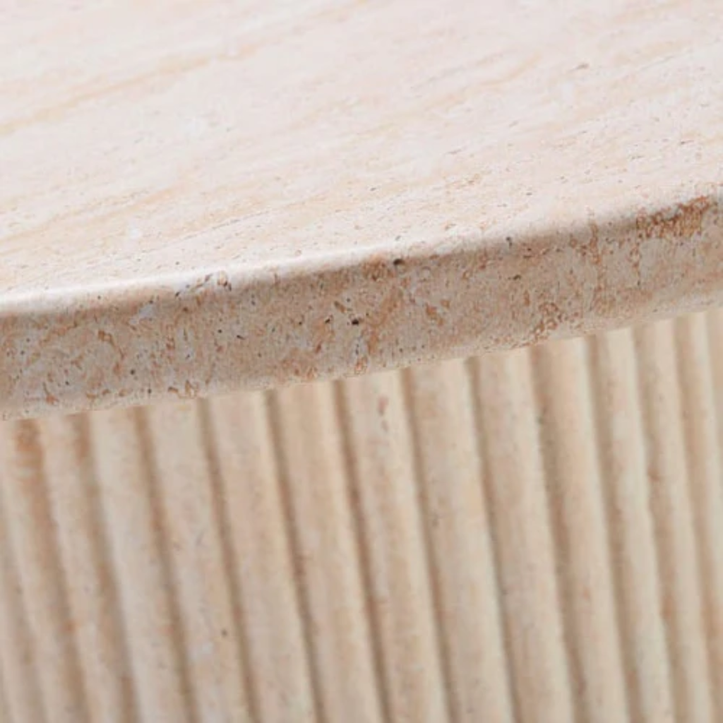 Close-up of a textured stone surface with a ribbed pattern