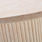 Close-up of a textured stone surface with a ribbed pattern