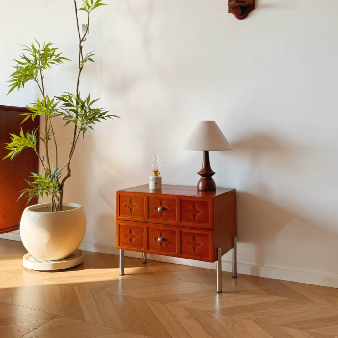 Vintage Style Mahogany Bedside Table with lamp and plant on a wooden floor