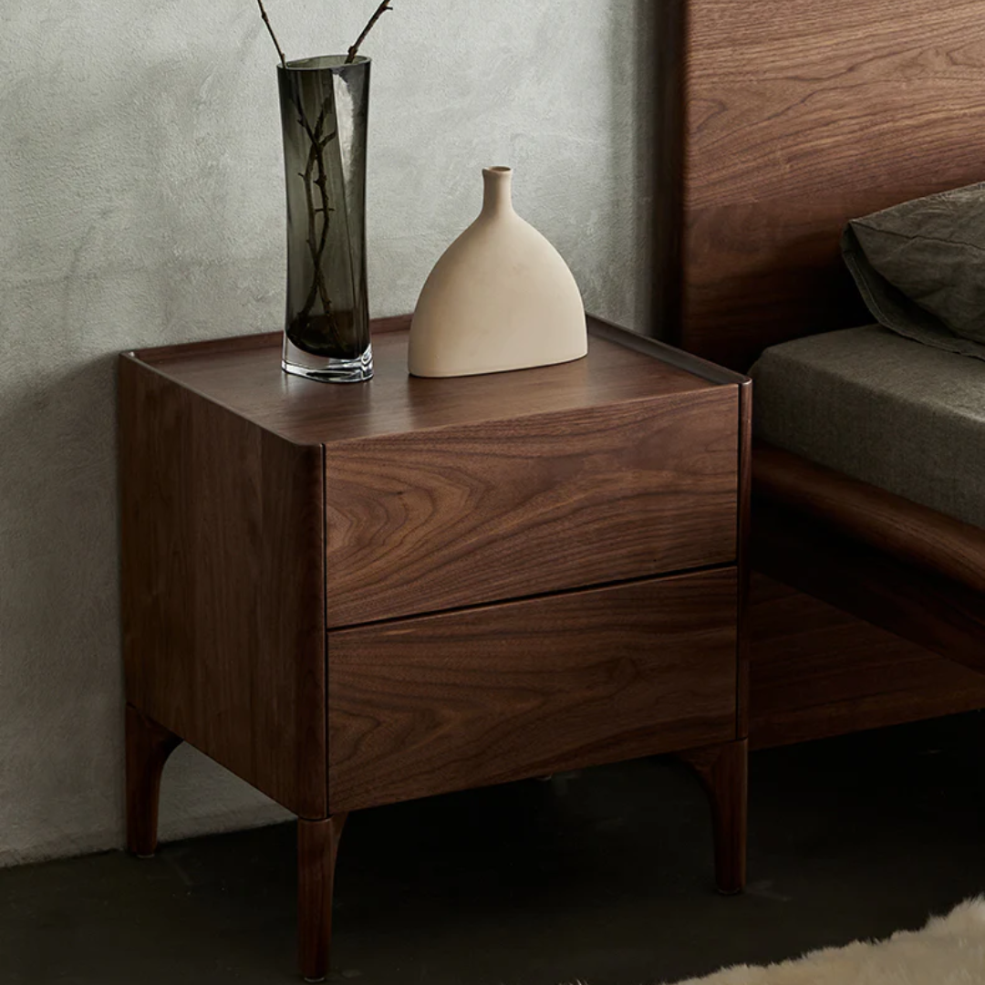 Walnut Bedside Table With Drawers With Curved Legs with two vases on a neutral background