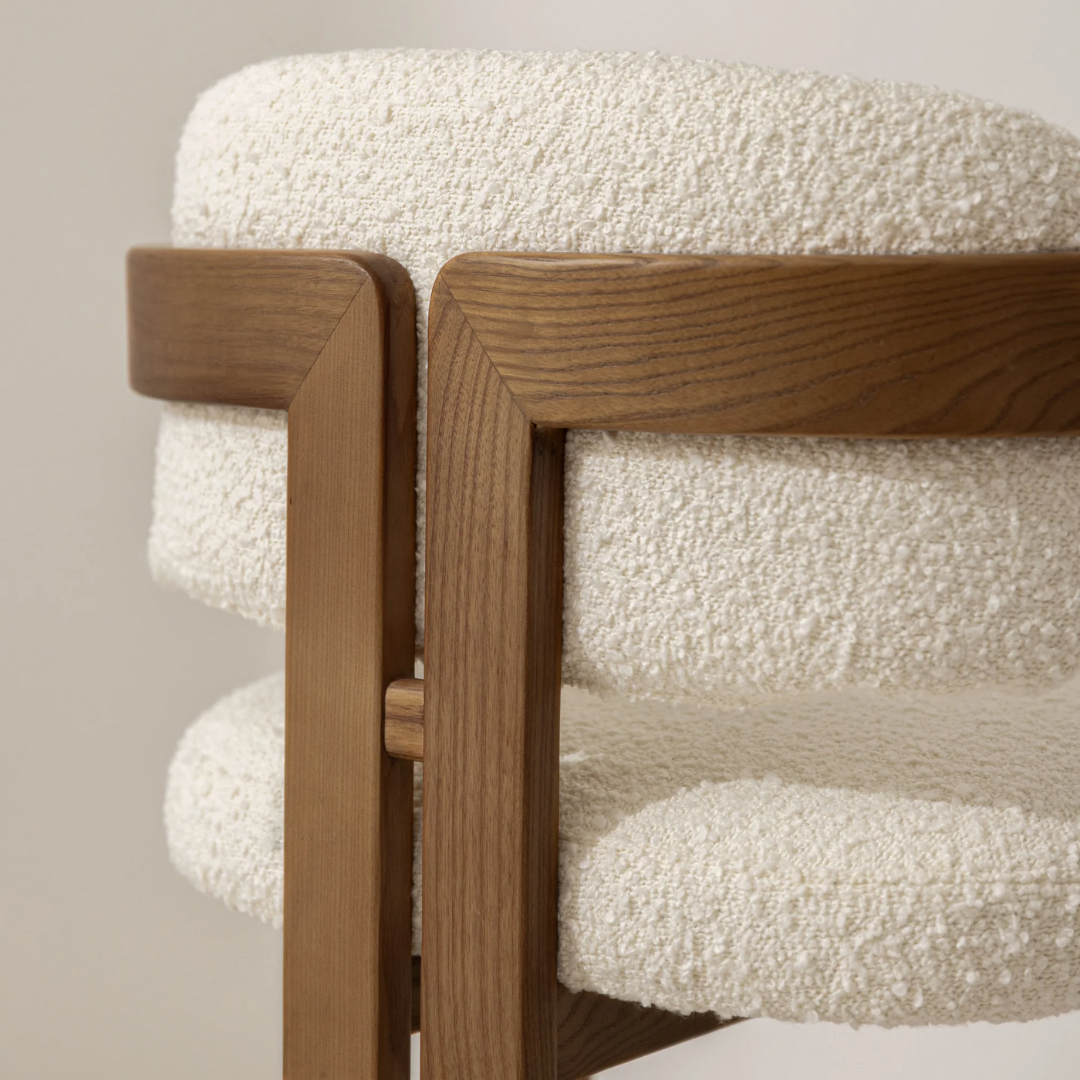 Walnut Boucle Curved Dining Room Chair close up of the boucle fabric and wood frame