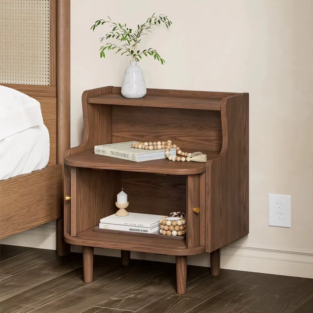 Wooden nightstand with decorative items in a bedroom setting