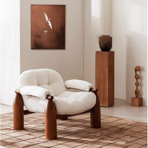Statement Accent Chair With Walnut Wood Frame in a room with a painting and sculptures.