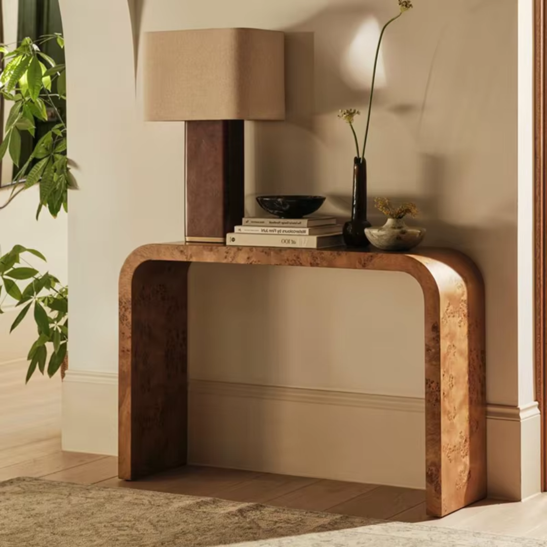 Modern console table with decorative items against a neutral wall