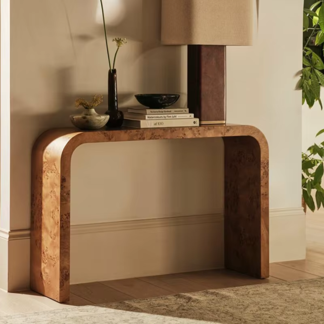 Marble Top Console Table With Rounded Corners with decorative items in a room setting