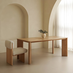 Rectangular Wooden Dining Table with a chair in a minimalistic room with neutral colors